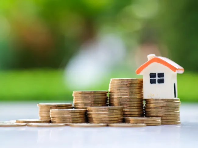 house on stack of coins